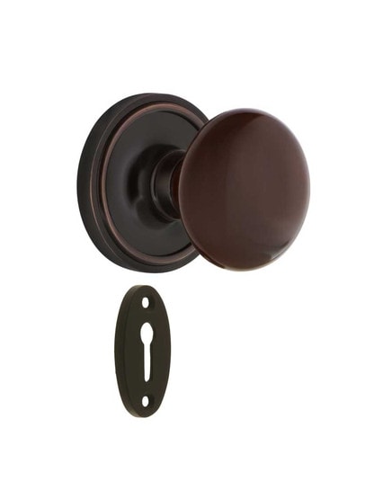 Classic Rosette Mortise-Lock Set with Brown Porcelain Knobs in Timeless Bronze.